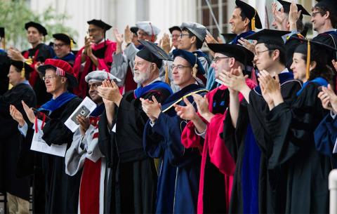 Faculty applaud MIT's newest PhDs; photo: Jake Belcher